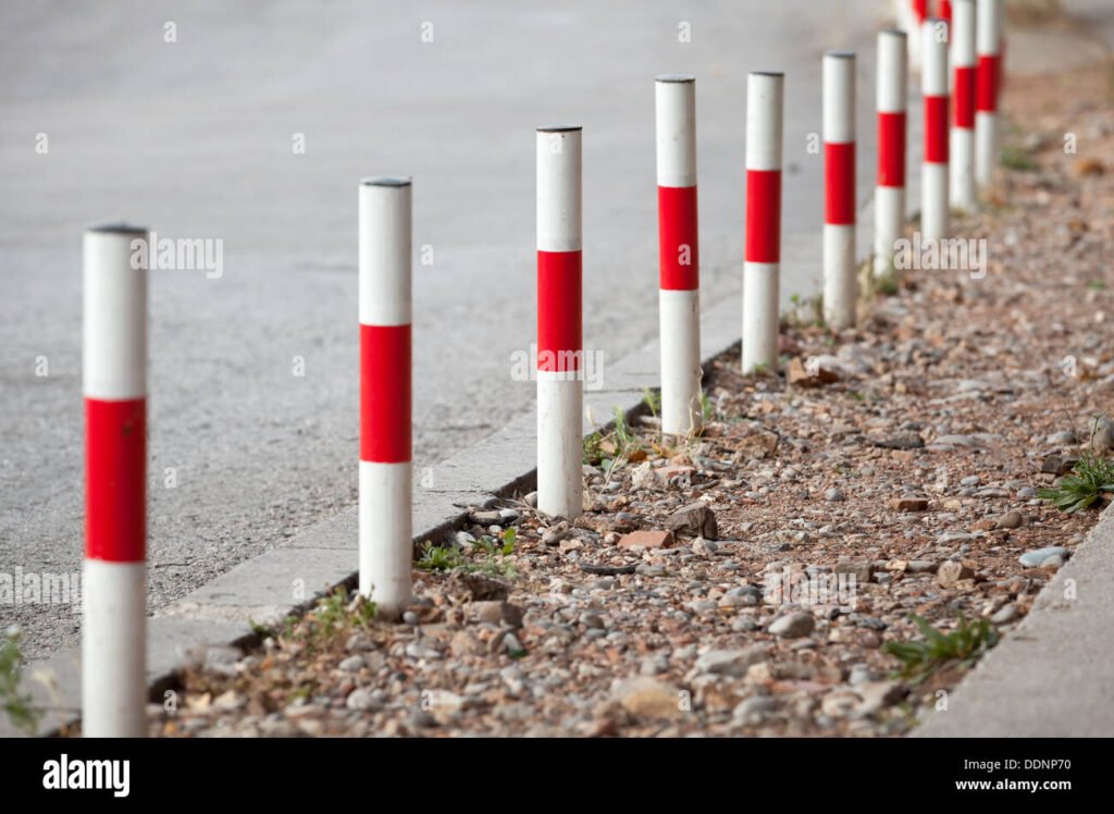 white and red railway poles in spanish country