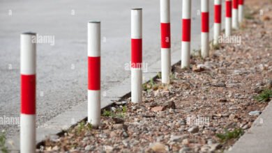 white and red railway poles in spanish country