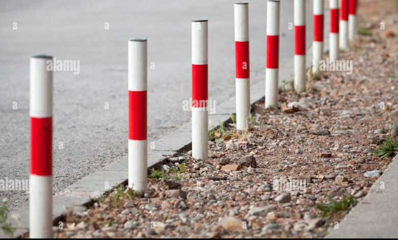 white and red railway poles in spanish country